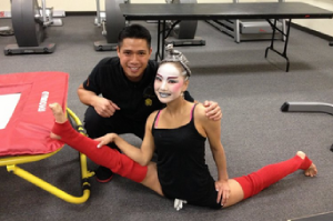 Jason Han getting his picture with Lillya Zhambaolova, a Cirque du Soleil Cortotionist